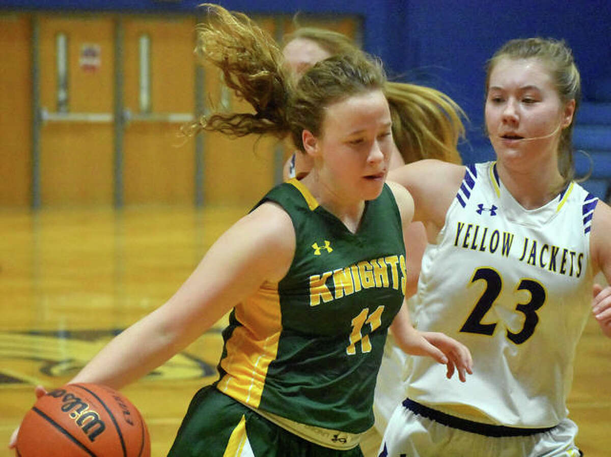 Metro-East Lutheran’s Caitlin Reynolds drives to the basket in the third quarter.