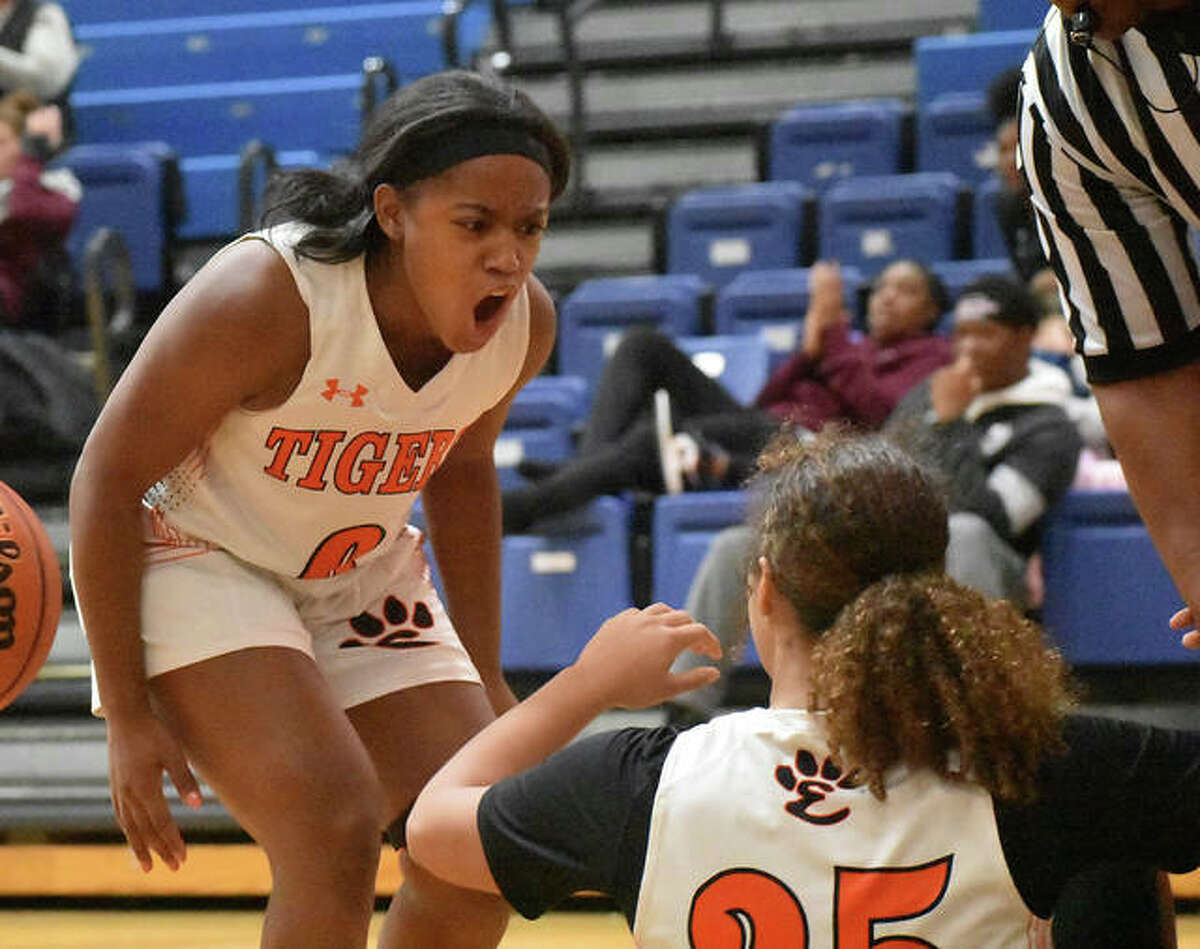 Edwardsville point guard Quierra Love is fired up after Sydney Harris hits a contested shot and draws a foul in the first quarter against Ladue.