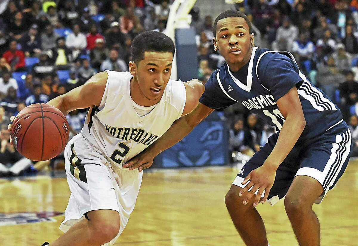 Notre Dame senior Tremont Waters drives past Hillhouse senior Jalil Wilkerson on March 1, 2017,at Quinnipiac University.