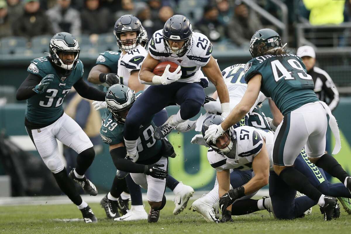 Seattle Seahawks' Travis Homer plays during the second half of an NFL football game against the Philadelphia Eagles, Sunday, Nov. 24, 2019, in Philadelphia. (AP Photo/Michael Perez)