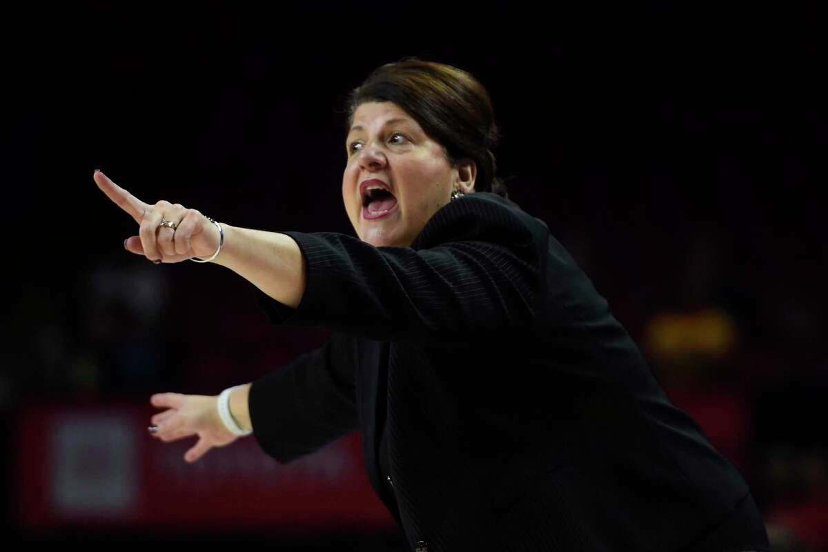 Quinnipiac head coach Tricia Fabbri instructs her team during the first half of an NCAA college basketball game against Maryland on Sunday, Nov. 24, 2019, in College Park, Md. (AP Photo/Gail Burton)