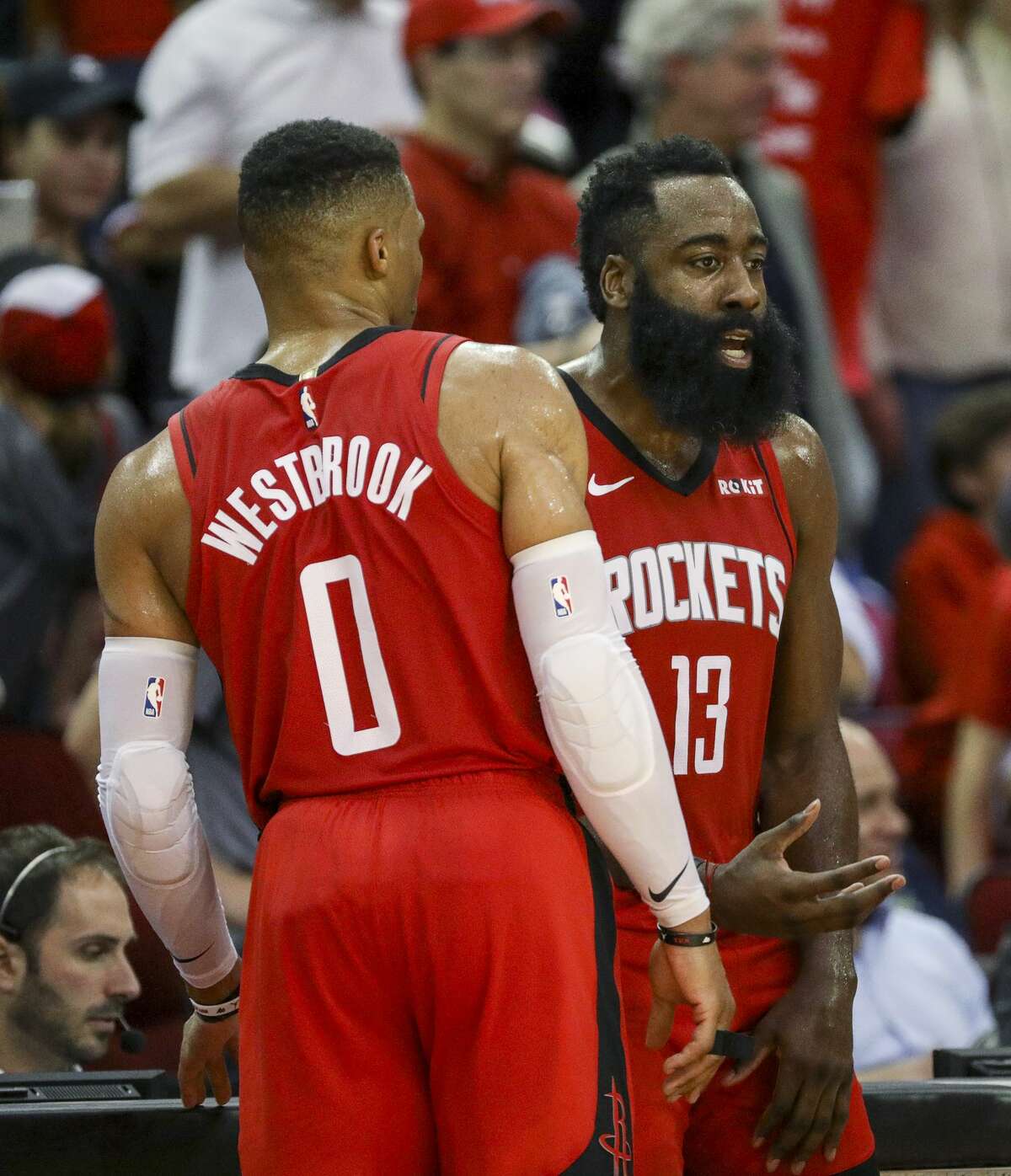 Houston Rockets guard James Harden (13) and guard Russell Westbrook (0) talk during a timeout during the fourth quarter of an NBA basketball game at the Toyota Center on Sunday, Nov. 24, 2019, in Houston.