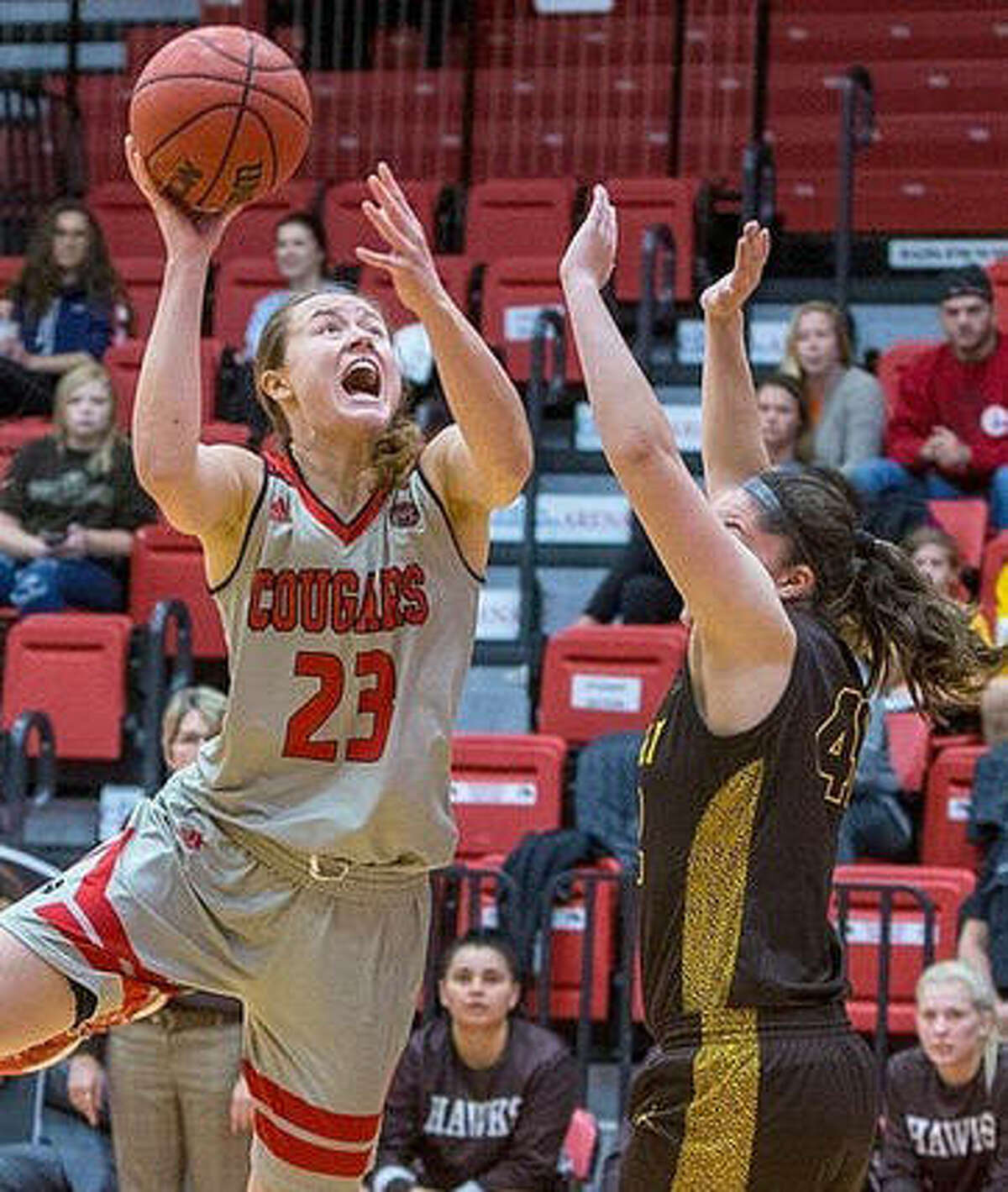 SIUE’s Allie Troeckler (23), shown putting up a shot in the lane in a game earlier this season in Edwardsville, scored 10 points Sunday to lead the Cougars in a loss at Missouri.