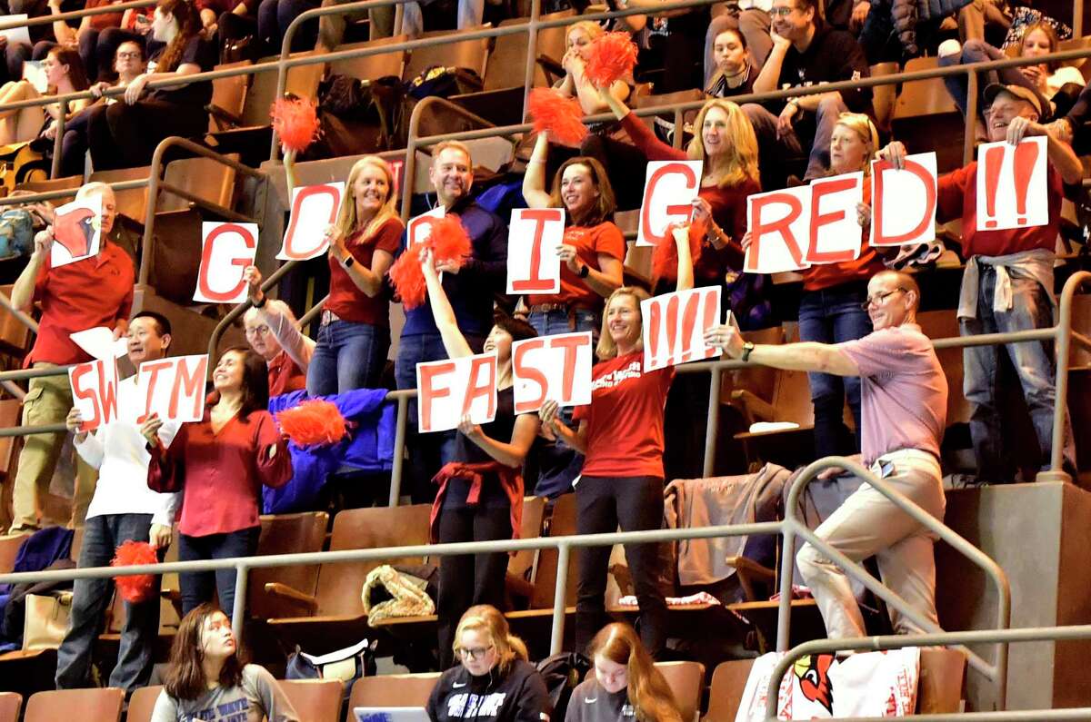 New Haven, Connecticut -Sunday, November 24, 2019: Greenwich H.S. fans cheer for their Cardinals during the CIAC State Open Girls Swimming Championship Sunday at Yale University in New Haven.