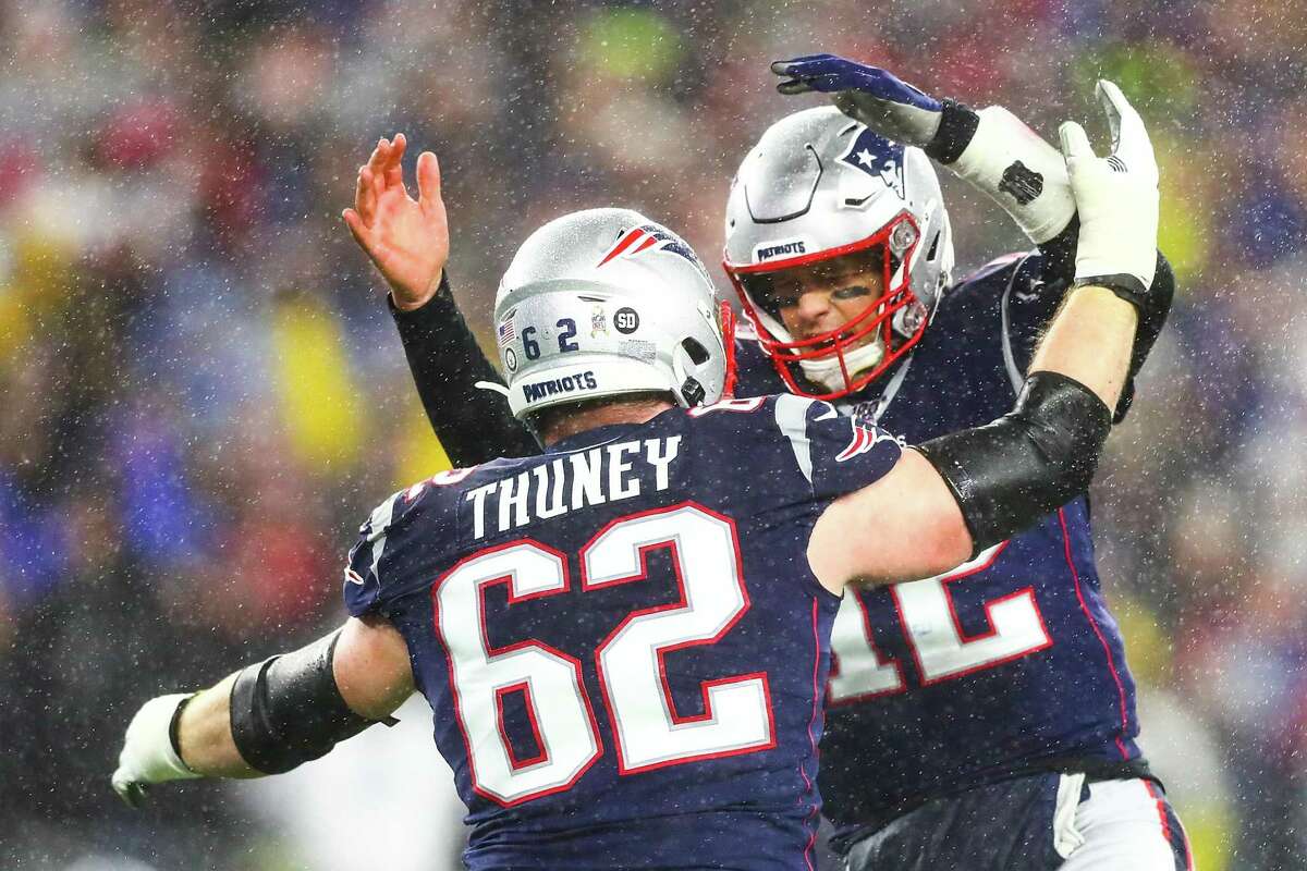 Tom Brady, right, of the Patriots celebrates with Joe Thuney after a touchdown in the first quarter during Sunday’s win over Dallas in Foxborough, Mass.