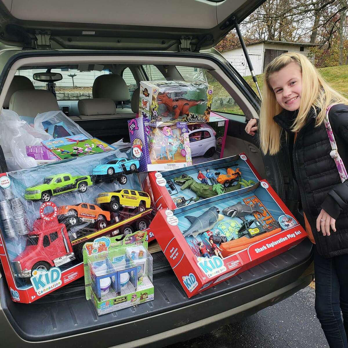 Faith Tremblay at The Edge Fitness Clubs Shelton last week picking up new unwrapped toys for YNHCH Toy Closet that people donated for Faith’s annual toy drive.