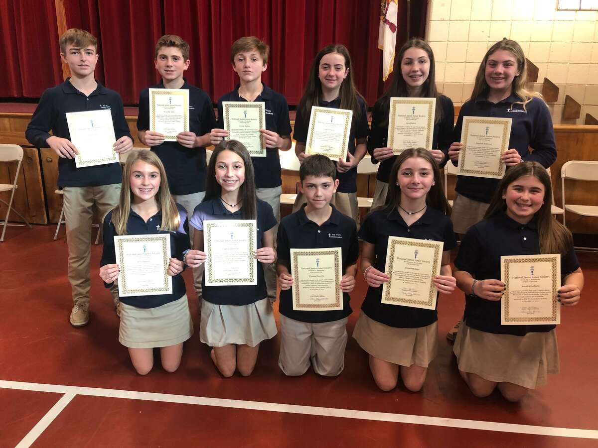 Eleven students at Holy Trinity Catholic Academy were inducted into the National Junior Honor Society Thursday, Nov. 21.