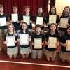 Eleven students at Holy Trinity Catholic Academy were inducted into the National Junior Honor Society Thursday, Nov. 21.