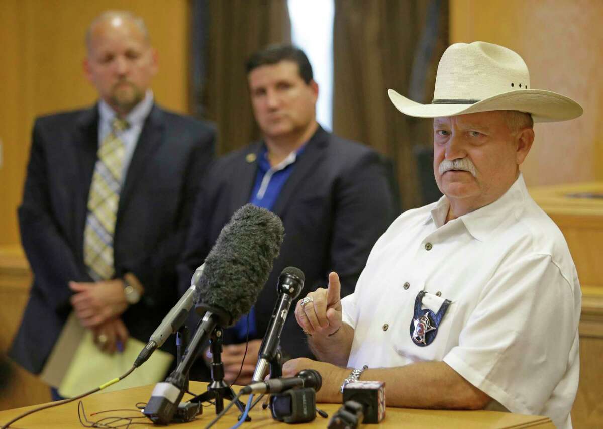 File photo shows Waller County Sheriff R. Glenn Smith, right, speaking to the media Thursday, July 16, 2015. Smith died Aug. 1, 2020 following a heart attack.