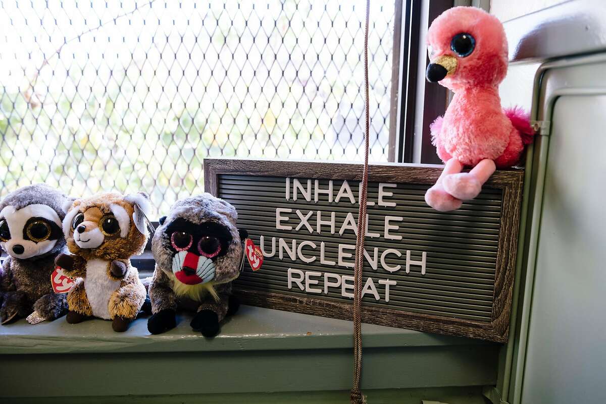 Stuffed animals sit next to an inspirational sign in the office of Rosalind Kingsley-Hurst, a Wellness Together mental health specialist at Coliseum College Preparatory Academy in Oakland, California, Monday, November 18th, 2019. Blue Shield of California has launched a new $10 million program for Oakland, San Leandro, and San Diego Unified School Districts that will pay for 19 mental health clinicians at area schools for the next 5 years.