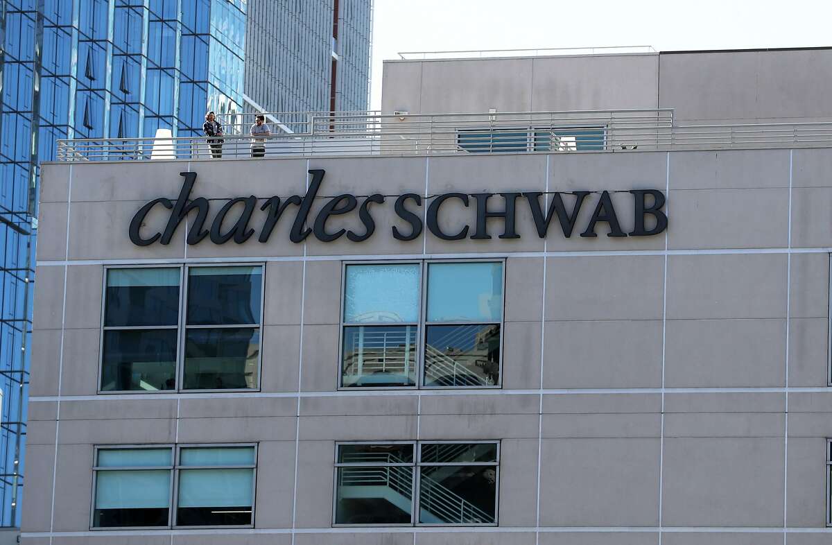 SAN FRANCISCO, CALIFORNIA - NOVEMBER 25: Workers stand on a rooftop deck at a Charles Schwab office on November 25, 2019 in San Francisco, California. Brokerage firm Charles Schwab announced plans to buy rival firm TD Ameritrade for $26 billion. (Photo by Justin Sullivan/Getty Images)