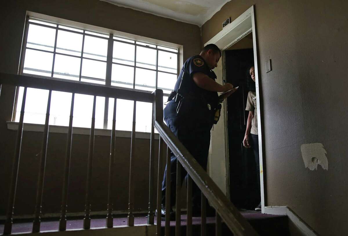 Bexar County Deputy Constable Edward Prado serves an eviction notice at Spanish Oaks Apartments on the North Side. The following photos are from "Kicked Out" -- an Express-News investigation about the high eviction rate in San Antonio. Read the full series.