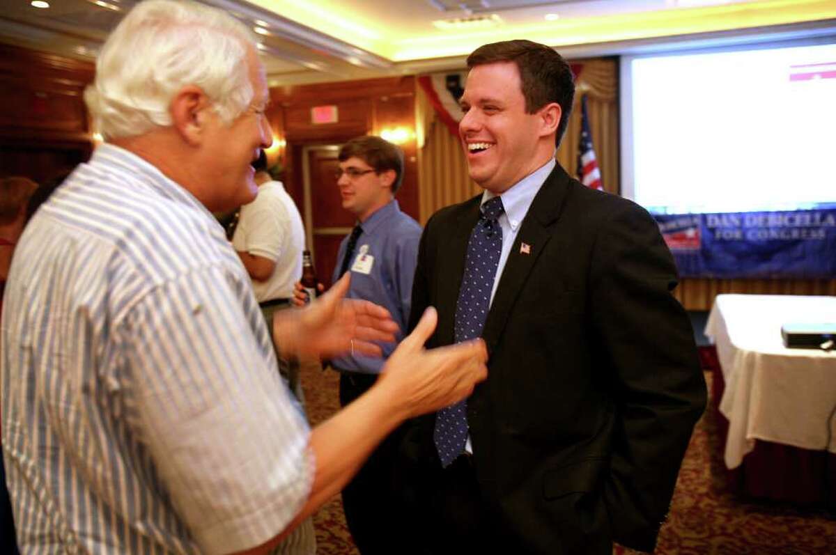 4th Congressional District Republican primary candidate Dan Debicella, right, greets supporter Ed Whitney of Westport at the Norwalk Inn on Tuesday night, August 10, 2010.