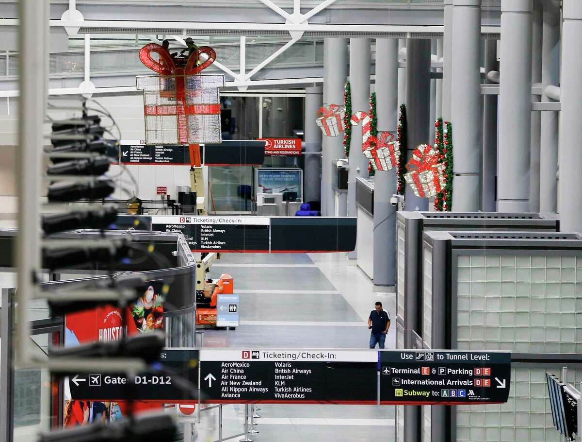 In one long night, workers deck the terminals of Bush Intercontinental Airport to lift spirits