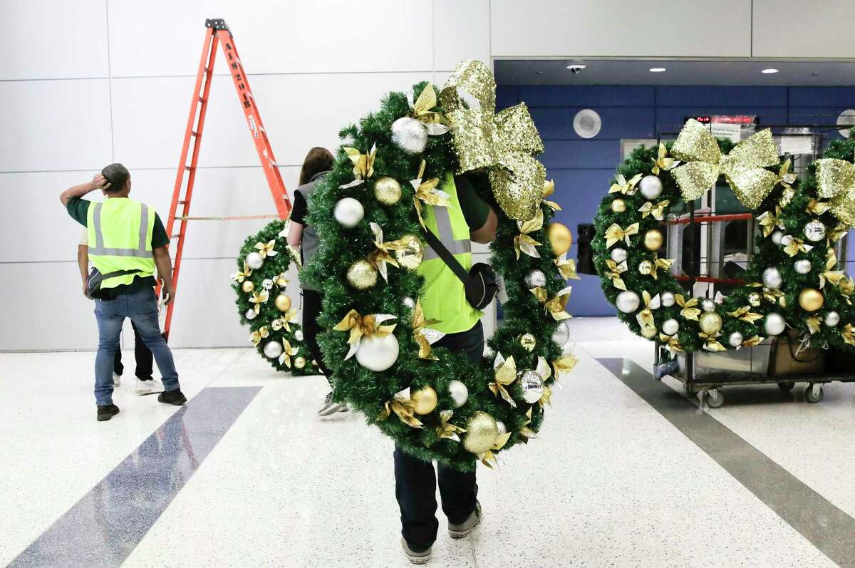 In one long night, workers deck the terminals of Bush Intercontinental Airport to lift spirits
