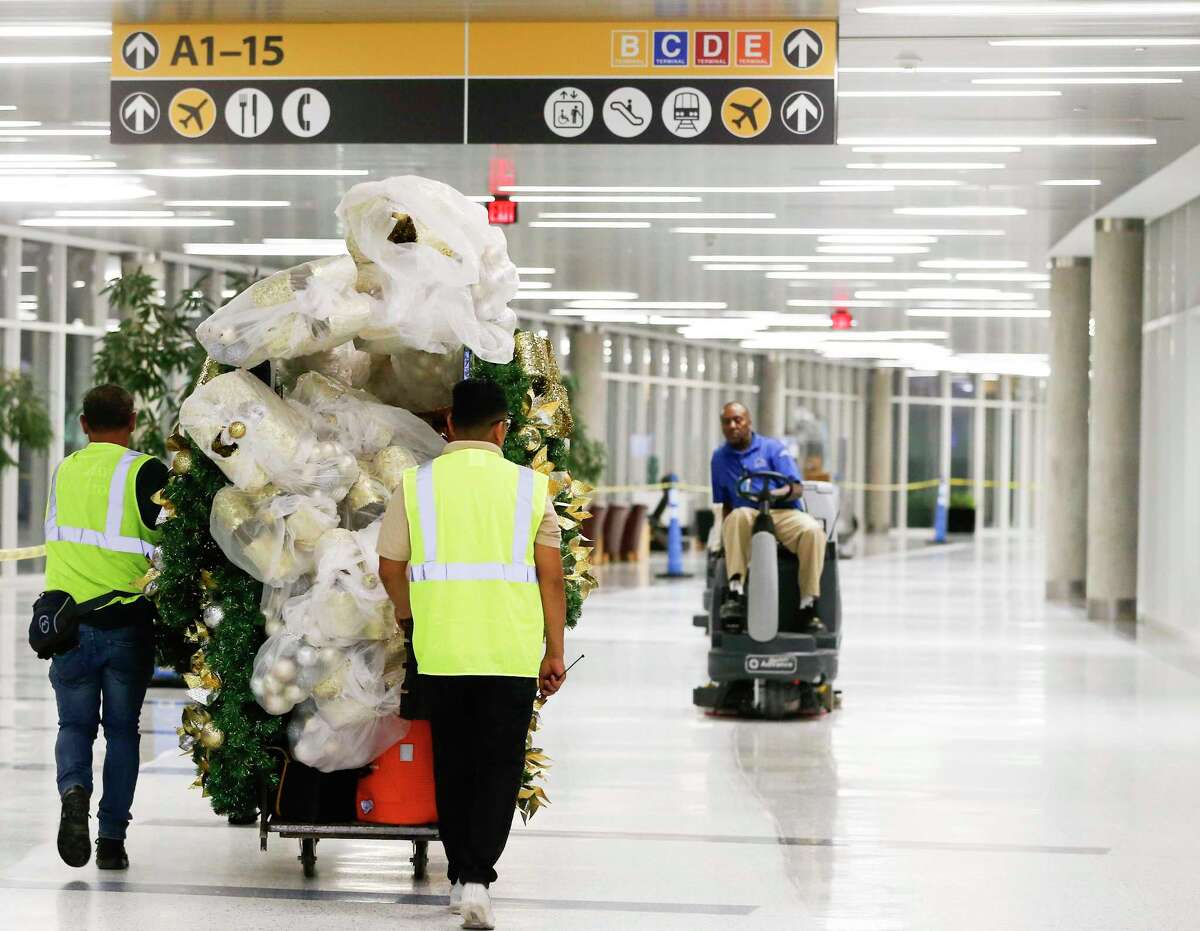 In one long night, workers deck the terminals of Bush Intercontinental Airport to lift spirits