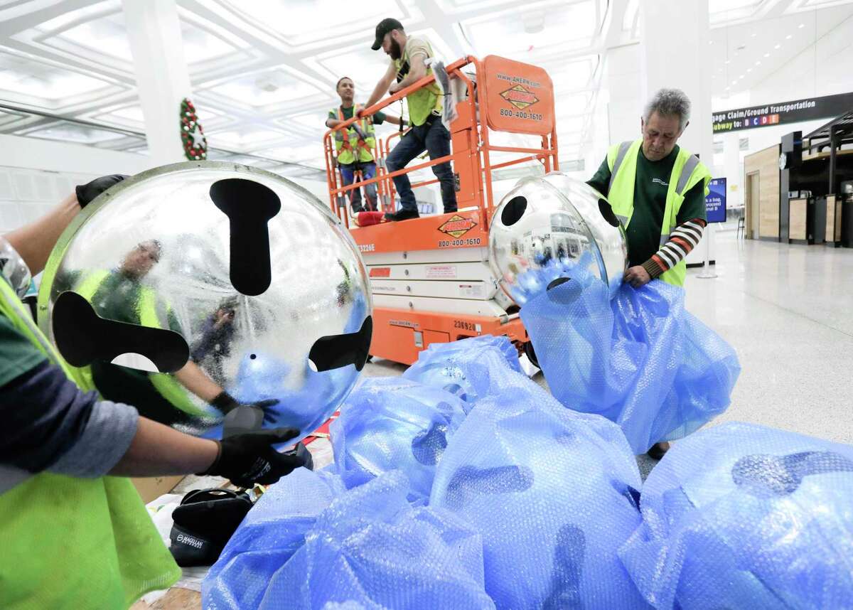 In one long night, workers deck the terminals of Bush Intercontinental Airport to lift spirits