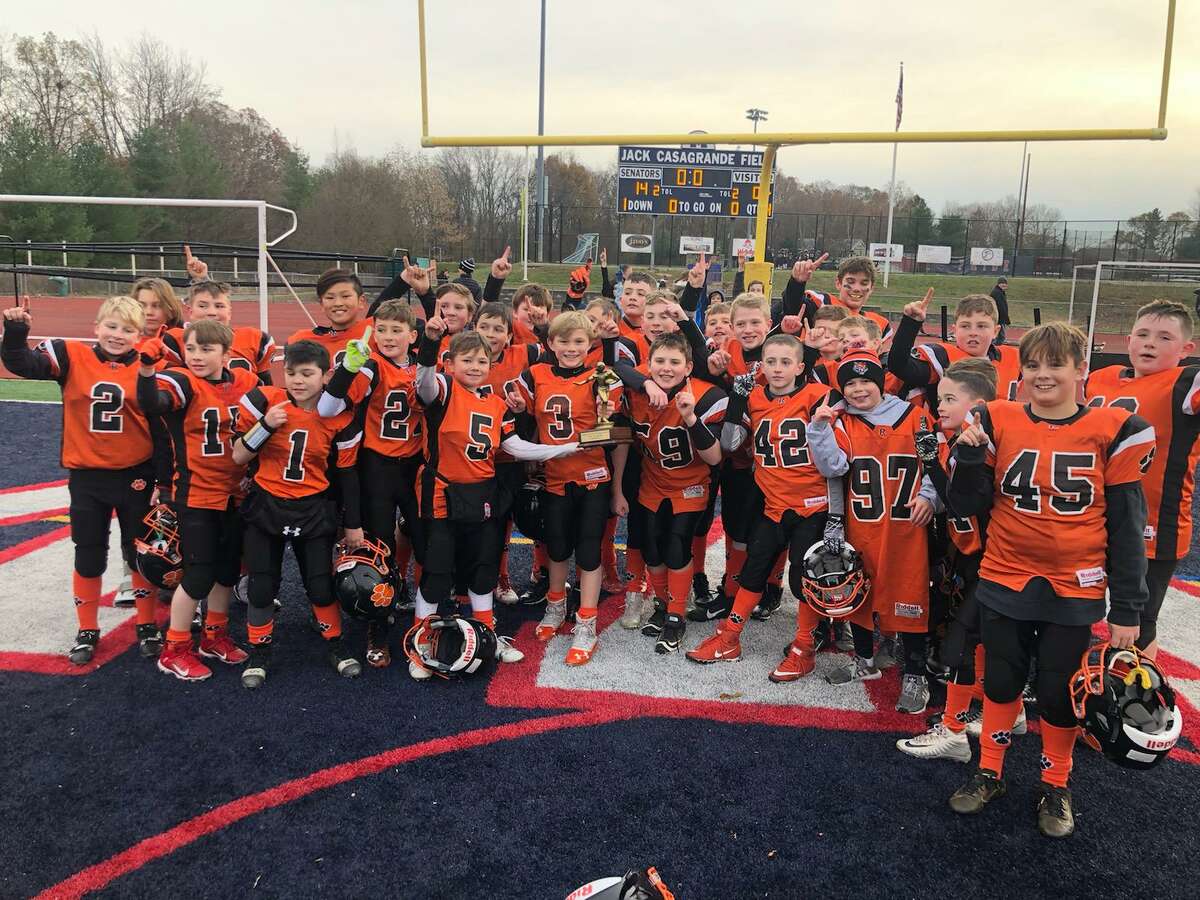 Ridgefield celebrates after winning the Fairfield County Football League's fifth grade division championship.