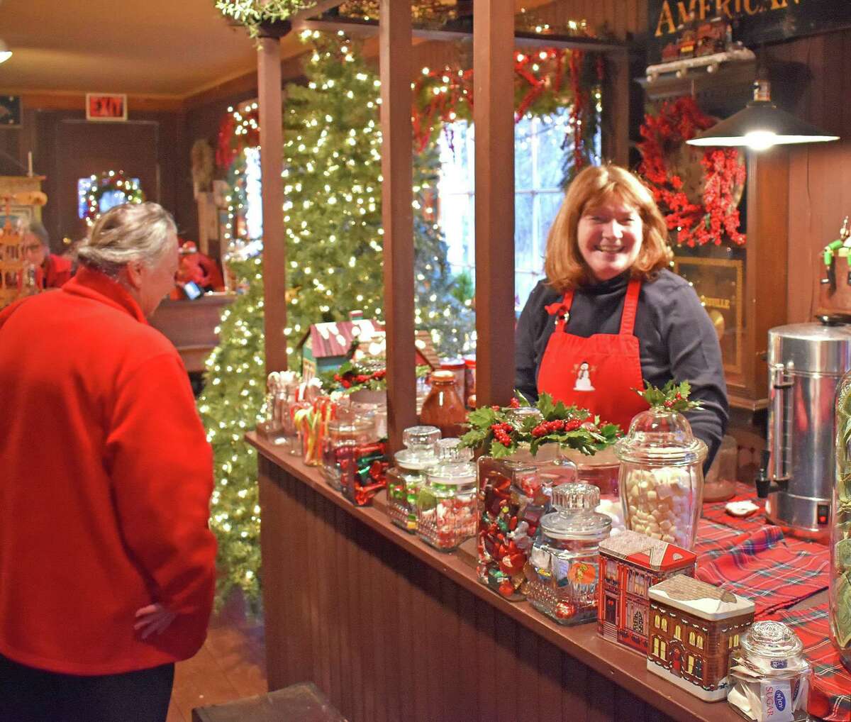 Georganne Bensh, the driving force behind the Christmas show at Merwinsville Hotel in Gaylordsville, is shown above at last year's festive event. This year's event will open Nov. 29.