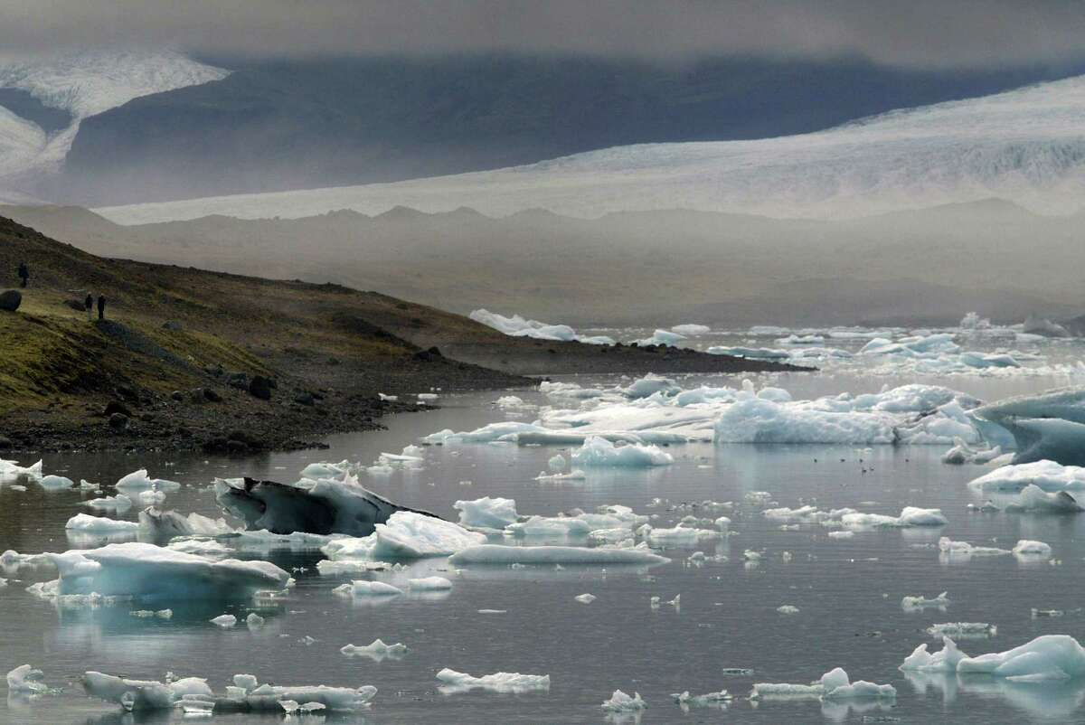 Icebergs break off the Vatnajokull Glacier before floating to sea. -The world must slash its emissions of planet-warming greenhouse gases by 7.6 percent every year to 2030 or miss the chance to avert devastating climate change, the United Nations said/