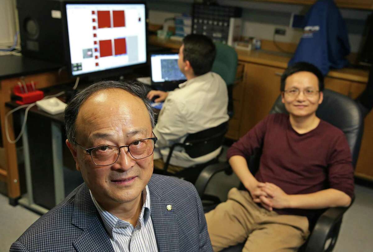 Xiaodu Wang, left, a professor of mechanical and biomedical engineering at the University of Texas at San Antonio, is testing the theory that a type of protein found in bone plays a role in the development of osteoporosis. With him in his lab are Dr. Wei Gao, right, and graduate student Joel Gomez, center.
