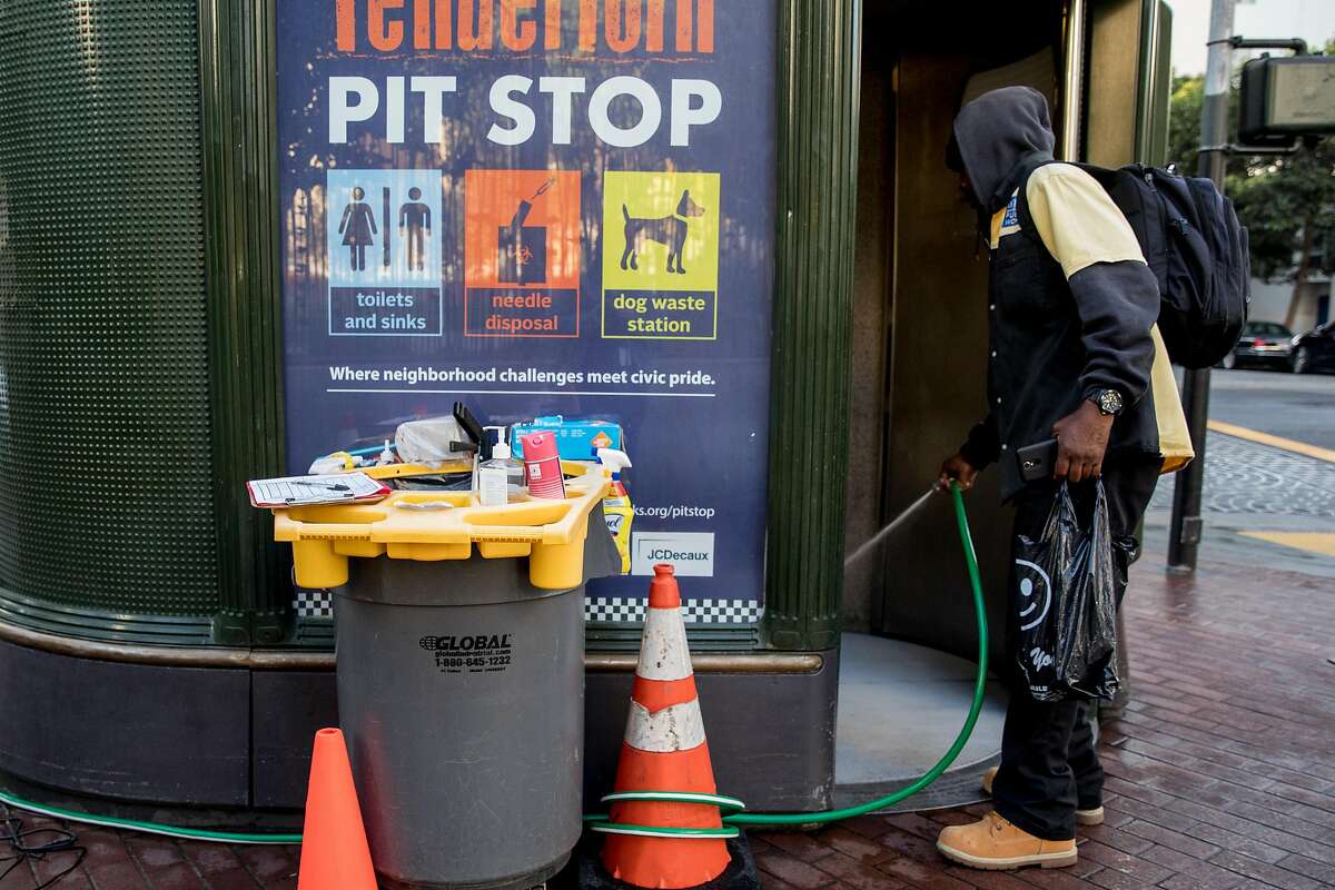 An attendant who declined to be identified cleans out the interior of a 24-hour Pit Stop restroom located on the corner of Eddy and Jones streets in the Tenderloin district of San Francisco, Calif. Friday, Nov. 22, 2019.