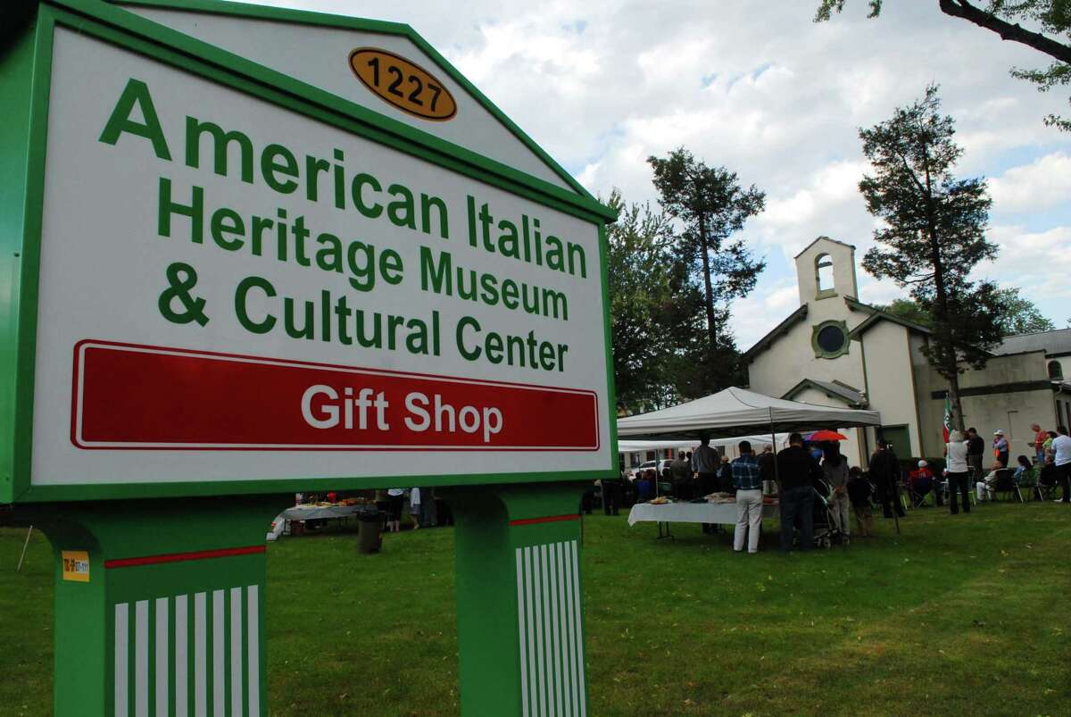 People gather on the lawn outside during the grand opening for the American Italian Heritage Museum in Albany, NY on Sunday, Oct. 4, 2009. (Paul Buckowski / Times Union)