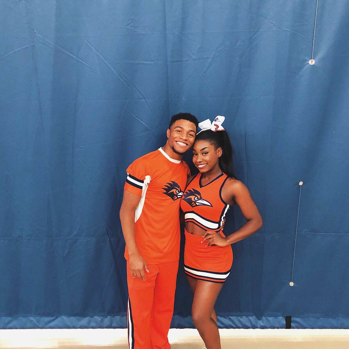 Tyriq Kuykendall, left, is seen in the photo with one of his teammates. Last Saturday, the University of Texas-San Antonio Cheerleader tumbled his way 100 yards in a video that has become viral.