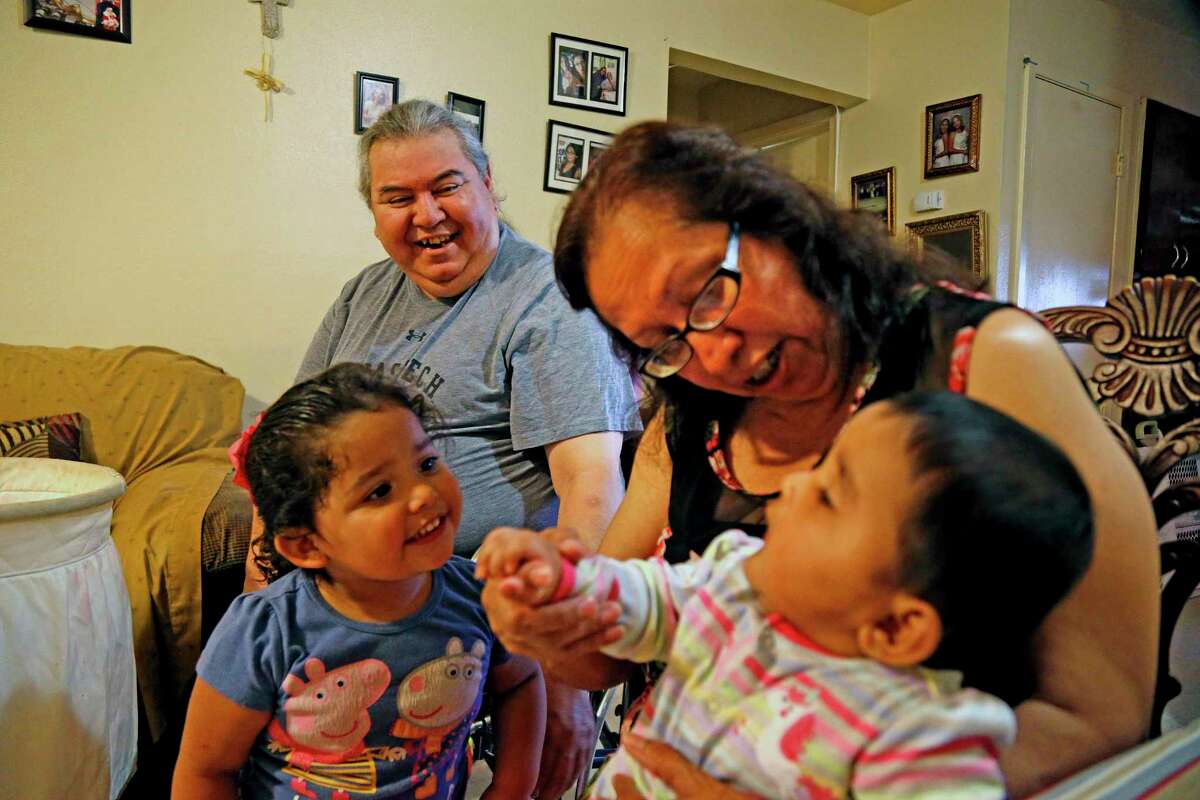Joe and Teresa Garcia, who are raising their grandchildren Izabella, left, and Ashley Marie Lopez, were told they were being evicted from their SAHA apartment after their daughter was arrested on a marijuana charge.