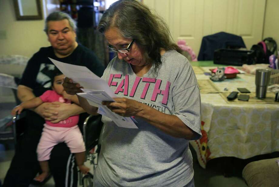 After the San Antonio Housing Authority dropped its eviction case against Joe and Teresa Garcia, the agency notified the couple about a pending rent increase. Teresa, 63, and Joe, 61, with granddaughter Ashley Marie, fear they will be priced out of the apartment. Photo: Bob Owen / ©2019 San Antonio Express-News