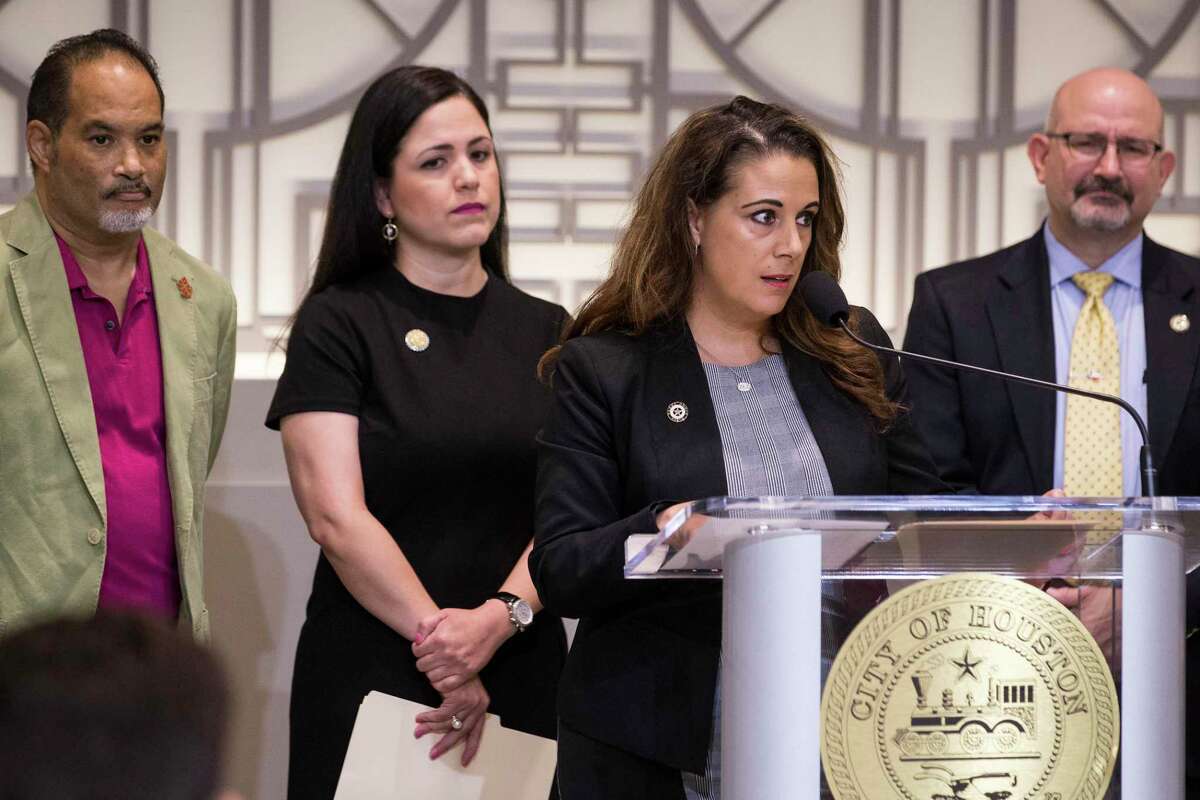 Rep. Gina Calanni, standing with other members of the Texas House Democratic Caucus, and Rep. Jon Rosenthal, right, are two Houston-area lawmakers Republicans are targeting in the 2020 election. A draft memo from within the Republican Party of Texas outlines a plan to buy domain names around a dozen Democratic campaigns and load the websites with negative information about the candidates. Here Calanni speaks during a news conference to demand Gov. Greg Abbott to call a special session aimed at limiting gun violence on Wednesday, Sept. 4, 2019, in Houston.