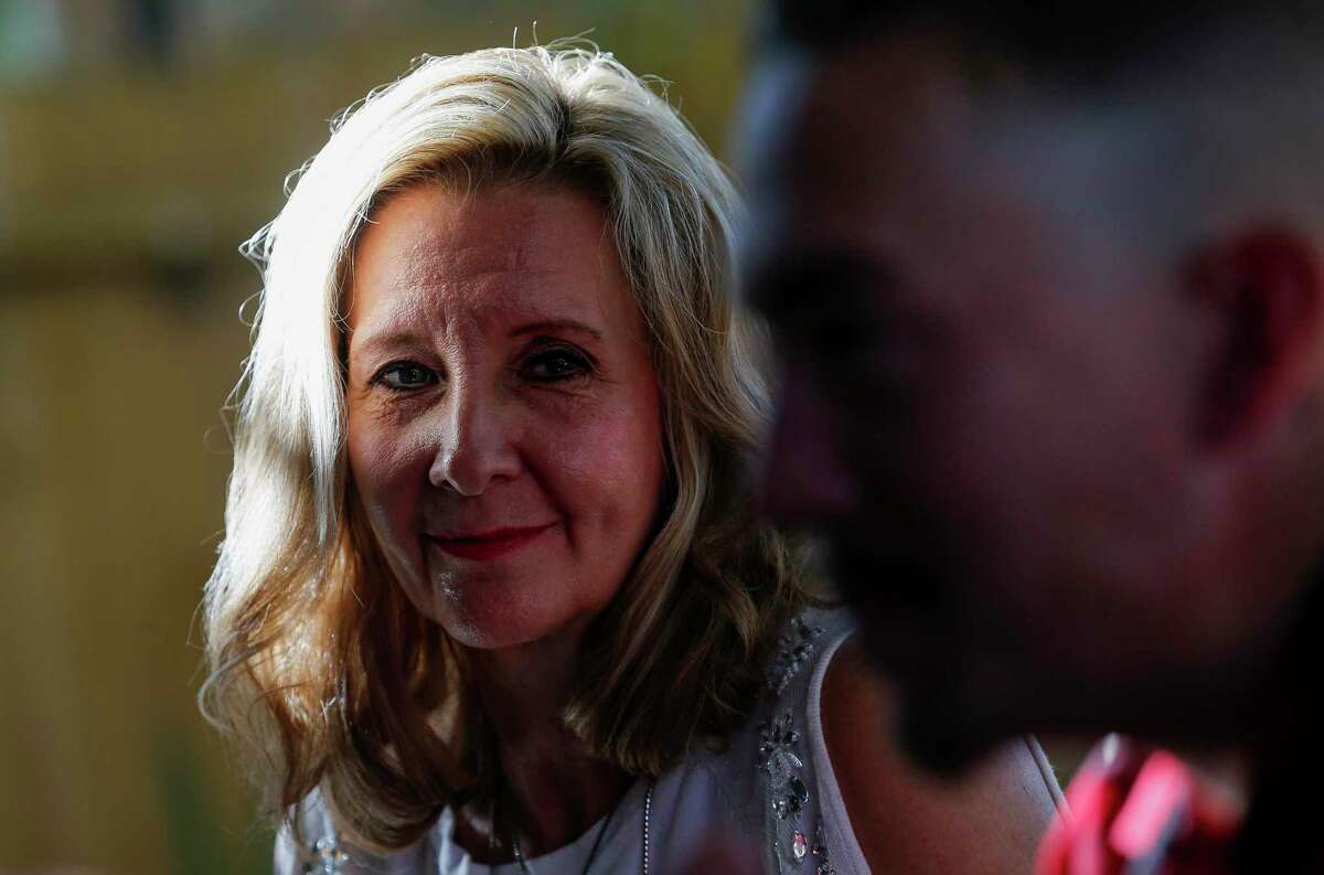 Shari Nightingale looks over to Kenyon Saylor White while talking about the process of introducing her granddaughter, Peyton, to her biological father, Kenyon, Sunday, Nov. 24, 2019, in Houston. White, a Houston native and musician, moved back home this year after discovering he has a 10-year-old daughter.