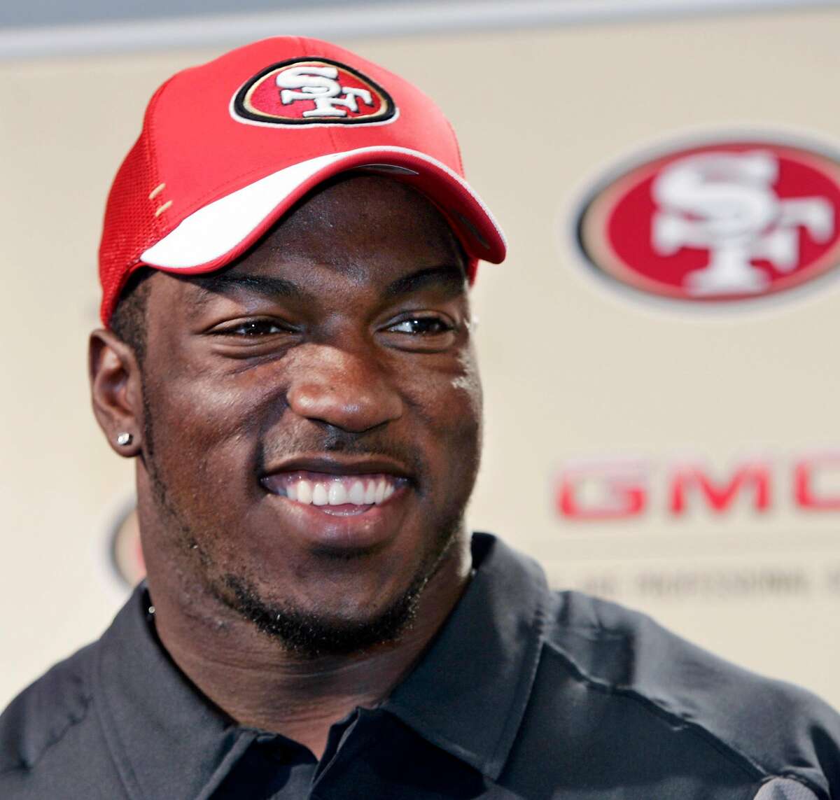 ** FILE ** San Francisco 49ers first round NFL football draft pick Patrick Willis smiles during a news conference at 49ers headquarters in Santa Clara, Calif., in this April 29, 2007 file photo. Willis won The Associated Press 2007 NFL Defensive Rookie of the Year award Friday Jan. 4, 2008. (AP Photo/Paul Sakuma)