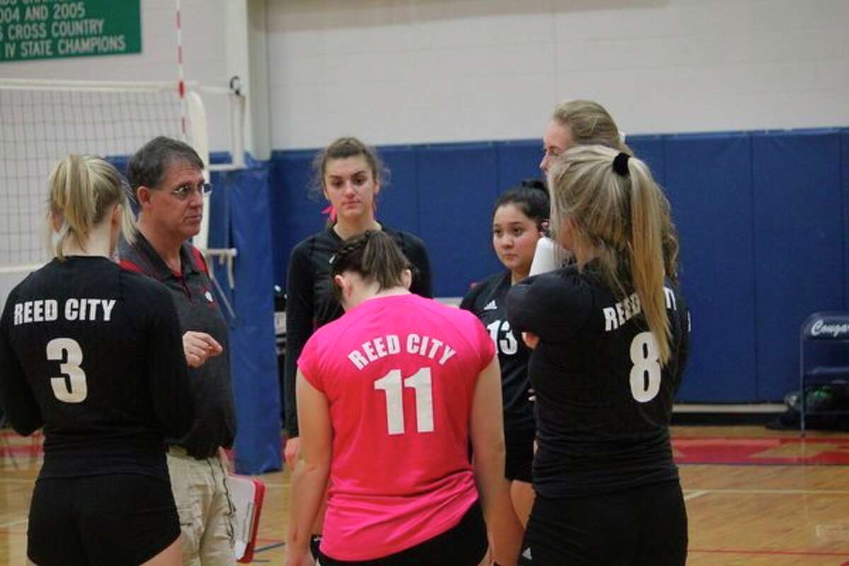 Reed City coach Don Patterson (left) talks with his players during the regular season, (Herald Review photo/John Raffel)