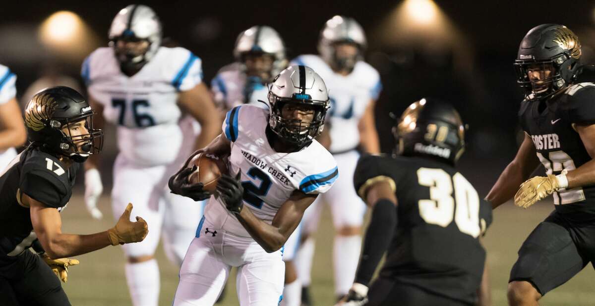 PHOTOS: High school football playoffs - area round  Randy Masters (2) of the Shadow Creek Sharks is surrounded by Foster Falcons defensive players in the first half after a short gain in a high school football game on Thursday, October 24, 2019 at Traylor Stadium in Rosenberg Texas. >>>See photos from last week's second-round playoff matchups ...