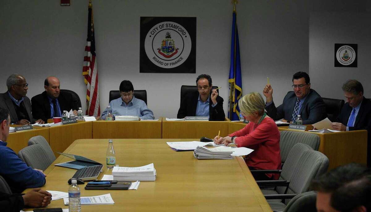 Republican Sal Gabriele, second from right, seconds a motion, one of his final acts as a member of the City of Stamford's Board of Finance during a the monthly BOF's public meeting at the Government Center on Nov. 14, 2019 in Stamford, Connecticut. Gabriele is leaving the Board of Finance in the middle of his term because of work commitments. Gabriele, who has been an elected official for 12 years, started on the Board of Representatives, where he made headlines for calling out nepotism, the scrap metal scandal, and lack of government transparency. Seated with Gabrielle is Kiernan Ryan.