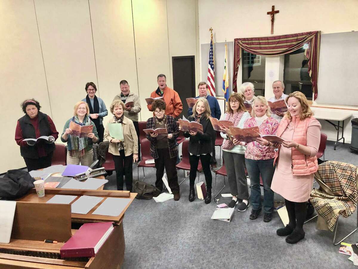 Our Lady of Fatima's Adult Choir practices for its annual Advent concert on Dec. 15.