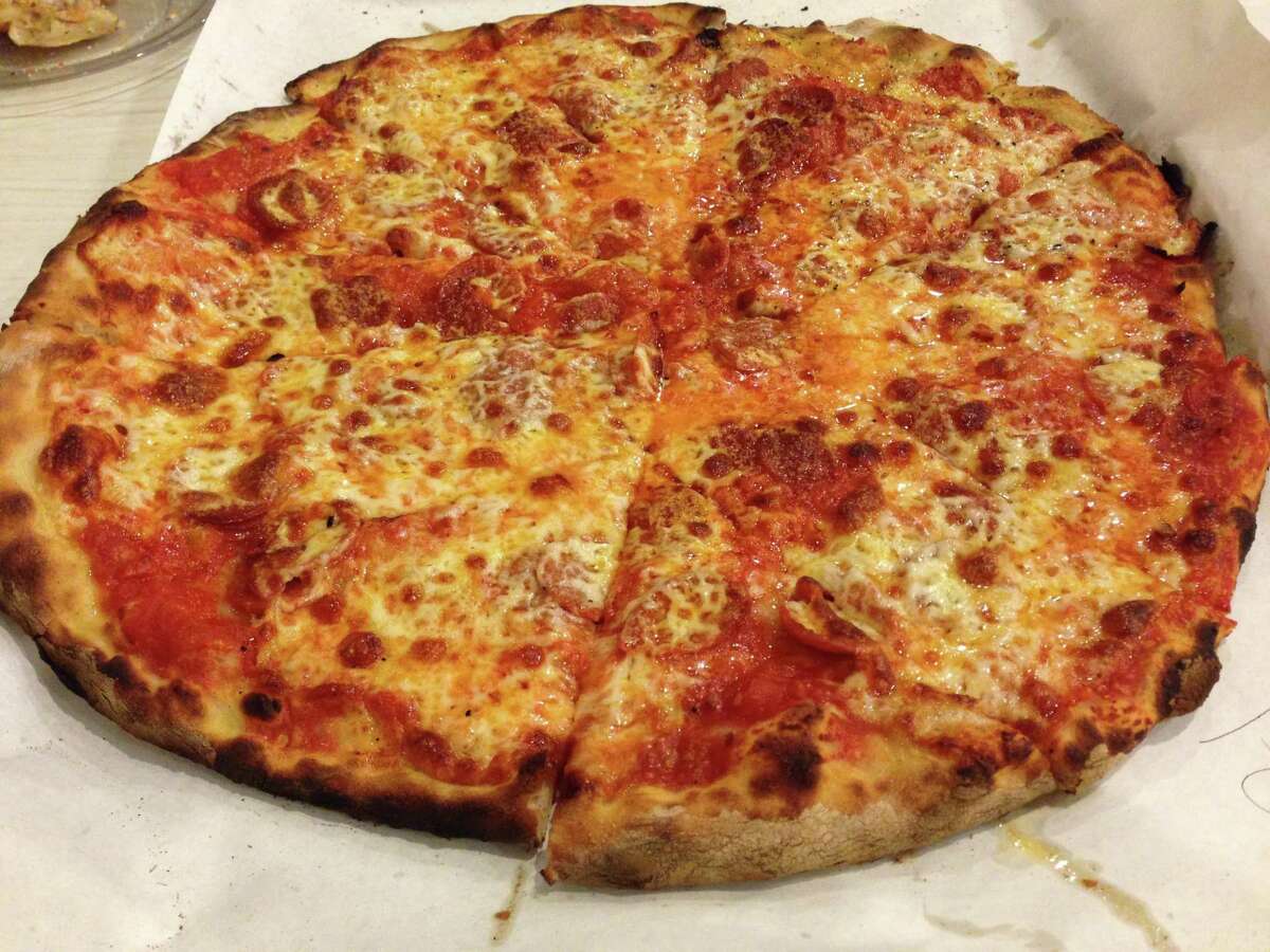 A tomato and mozzarella pizza from Frank Pepe Pizzeria Napoletana in New Haven.