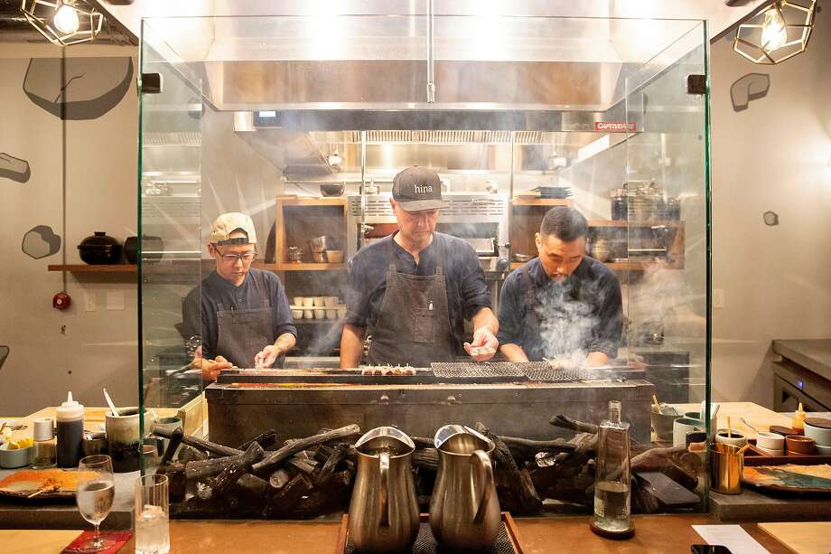 From left: Chefs Rich Lee, Tommy Cleary and Brian Shin cook at Hina Yakitori on Saturday, Nov. 16, 2019, in San Francisco, Calif. The yakitori restaurant is located at 808 Divisadero St. Photo: Santiago Mejia / The Chronicle