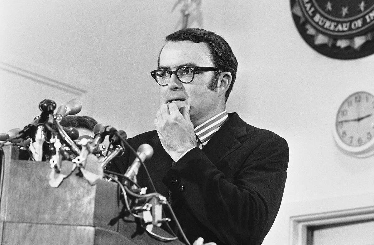 FILE - In this May 15, 1973, file photo, then-acting FBI director William Doyle Ruckelshaus pauses during a news conference in Washington. Ruckelshaus, who famously quit his job in the Justice Department rather than carry out President Richard Nixon's order to fire the special prosecutor investigating the Watergate scandal, has died. He was 87. The EPA confirmed his death in a statement Wednesday, Nov. 27, 2019. (AP Photo/Charles Gorry)
