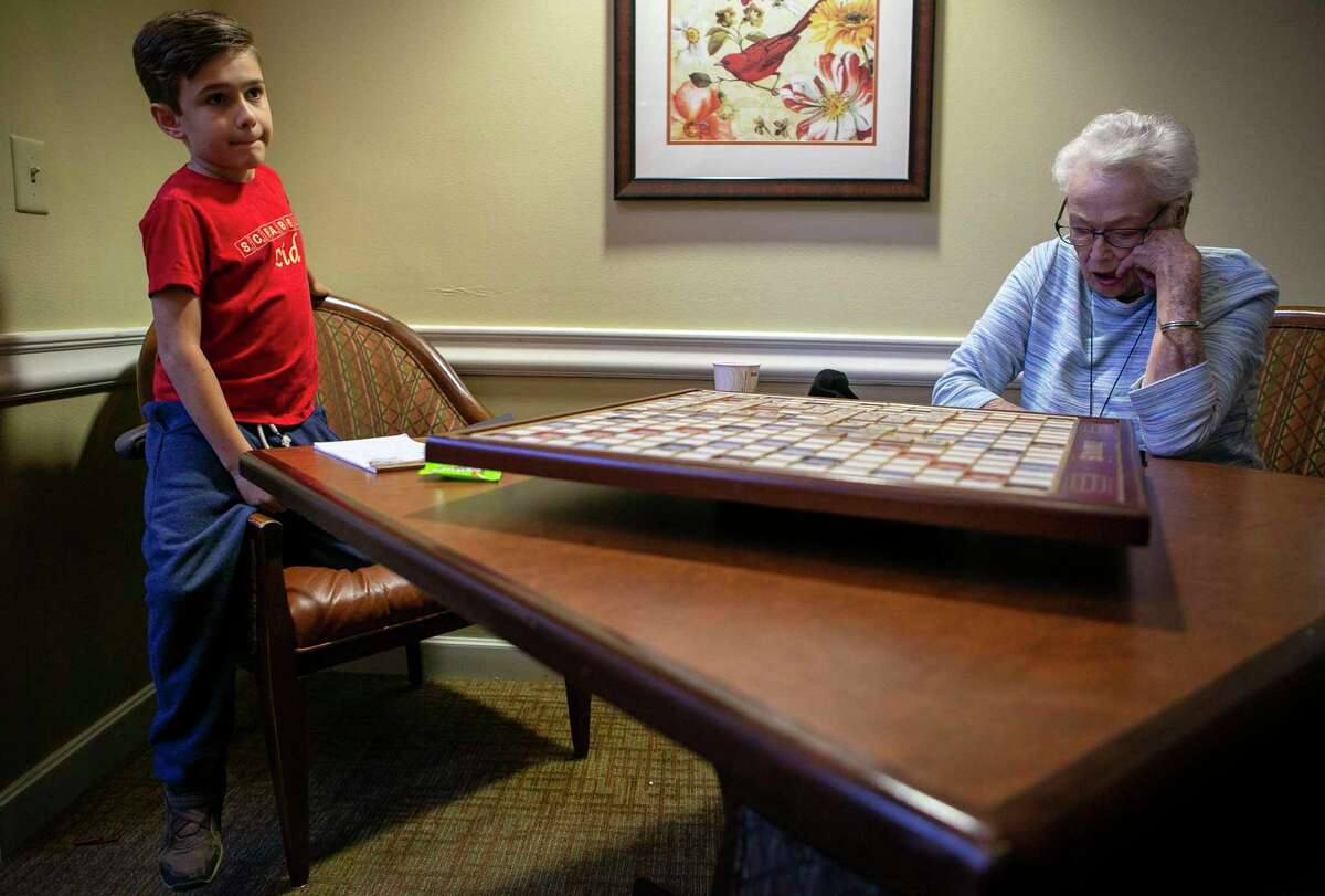 Ricky Rodriguez,10, plays Scrabble with Pat Griffith, 86, during their weekly Scrabble match at Brookdale Shavano Park, her assisted living center. Pat Griffith and Ricky socialize and play every Sunday. Ricky will be competing in the World English Language Scrabble Players Association youth cup in Malaysia this weekend.