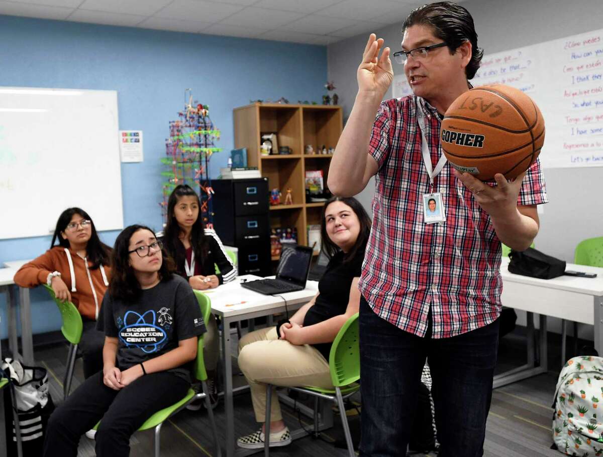 In 2019, Oscar Garcia, a math teacher at CAST Med High School, uses a basketball to explain parabolic curves. A reader has nothing but praise for public school teachers.