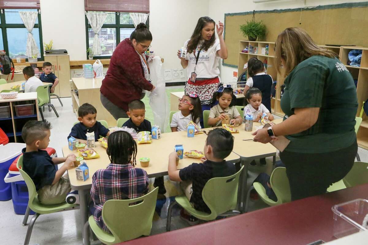 Pre-K students receive breakfast on the first day of school at Gardendale Elementary last August. Edgewood ISD has partnered with the city's Pre-K 4 SA program to turn the school into an early education center. Other school districts also are expanding preschool offerings. Eligibility to most public programs is based on household income, leaving access for middle class families a continuing problem.