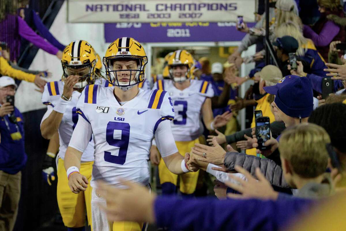 LSU quarterback Joe Burrow (9) looks to pass during the first half