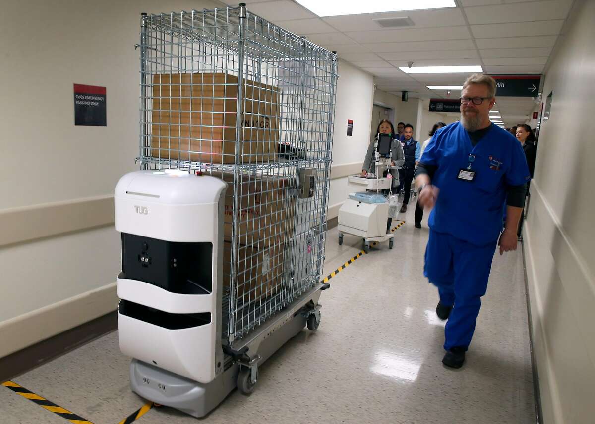 A Tug autonomous mobile robot transports supplies at the Stanford Medical Center in Stanford, Calif. on Tuesday, Nov. 26, 2019. Twenty-three of the robots will be joining a fleet of five already in service to deliver supplies and linen throughout the sprawling hospital.
