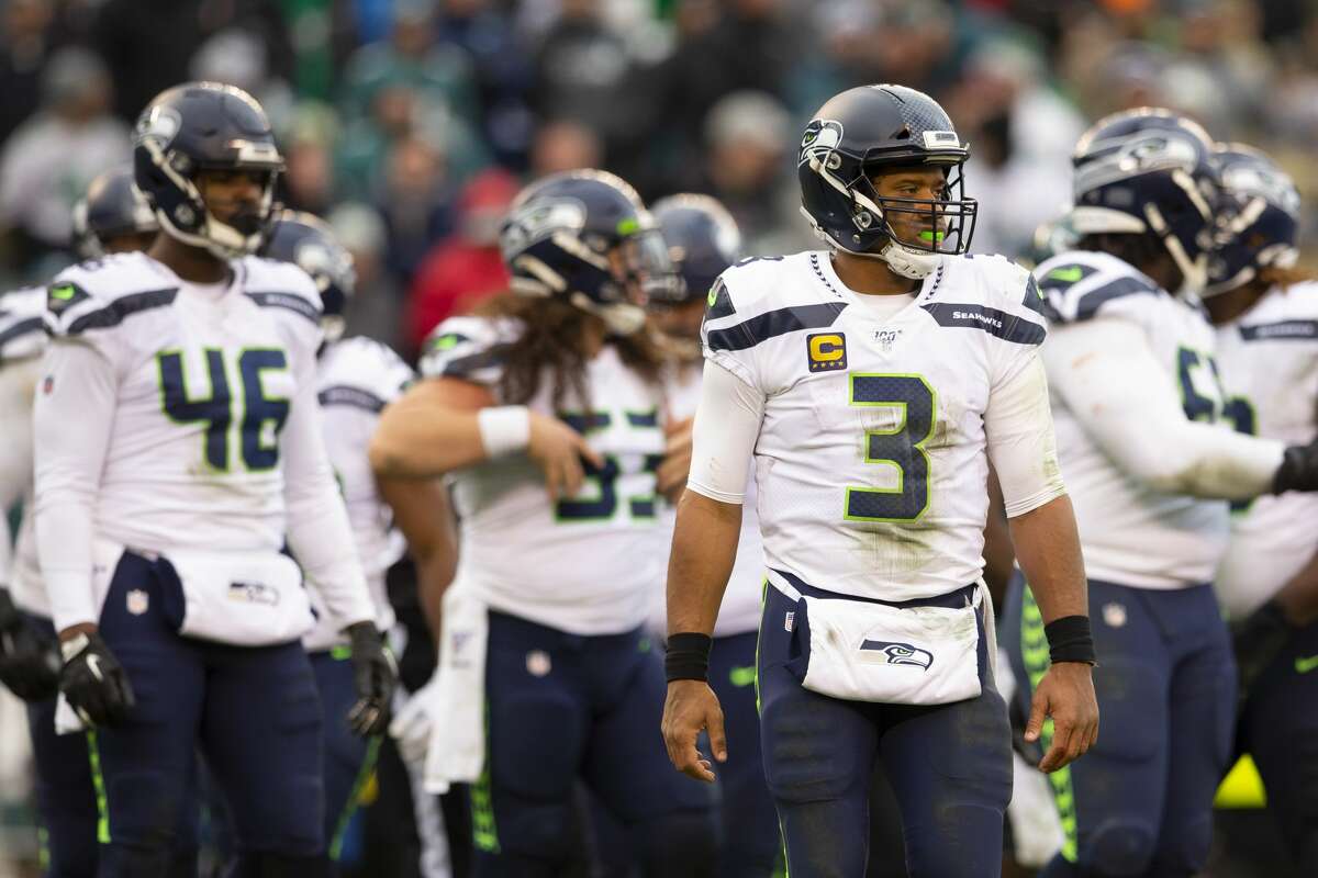 PHILADELPHIA, PA - NOVEMBER 24: Russell Wilson #3, Tyrone Swoopes #46, and Joey Hunt #53 of the Seattle Seahawks look on against the Philadelphia Eagles at Lincoln Financial Field on November 24, 2019 in Philadelphia, Pennsylvania. (Photo by Mitchell Leff/Getty Images)