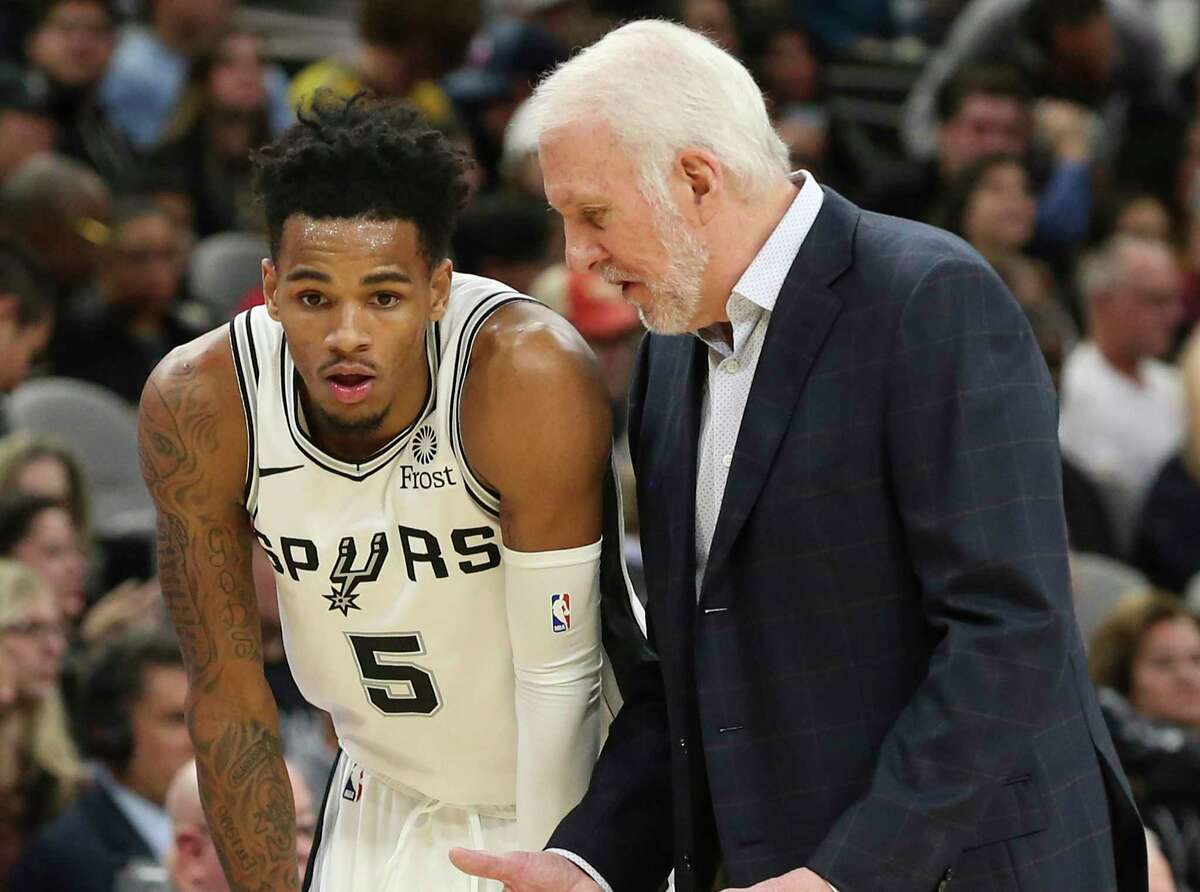 Gregg Popovich, right, said the goal for his team during the NBA restart is developing players such as Dejounte Murray.