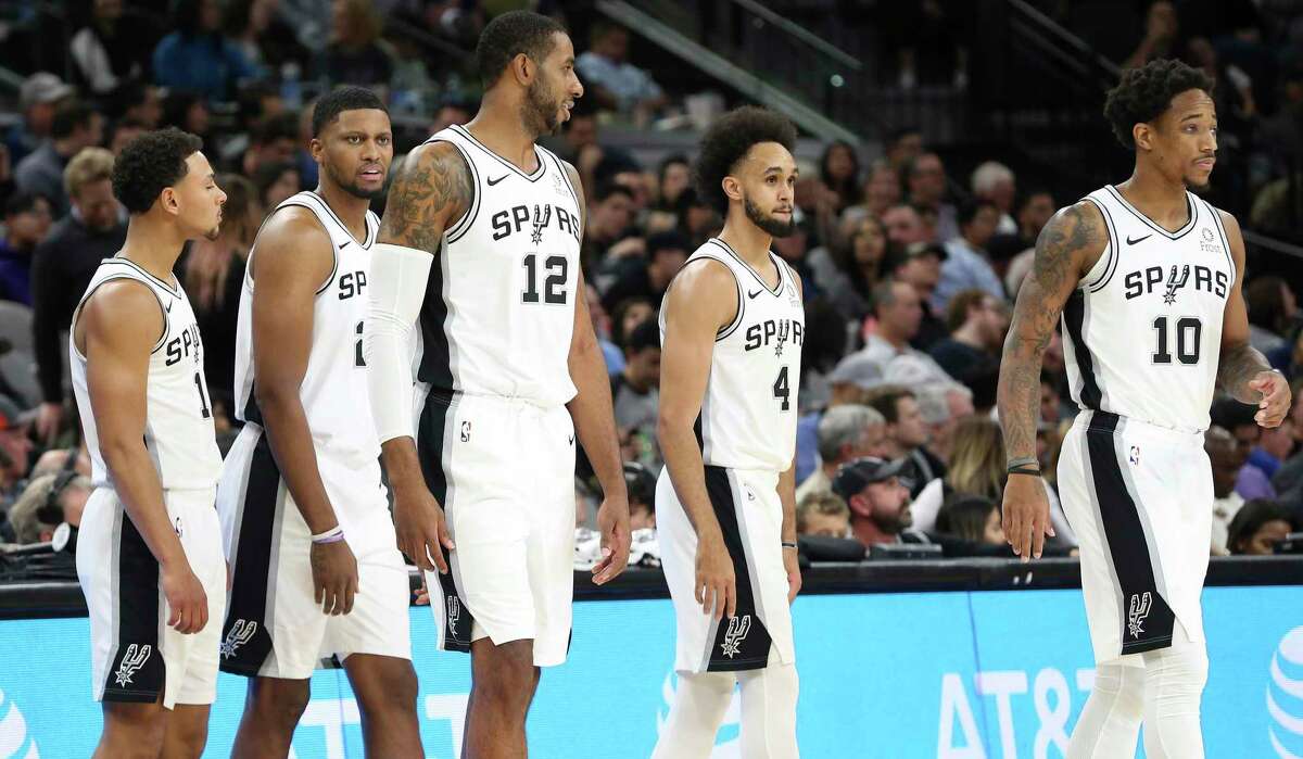Spurs players Bryn Forbes (11), Rudy Gay (22), LaMarcus Aldridge (12), Derrick White (04) and DeMar DeRozan (10) take the floor against the Minnesota Timberwolves during their game at the AT&T Center on Wednesday, Nov. 27, 2019.