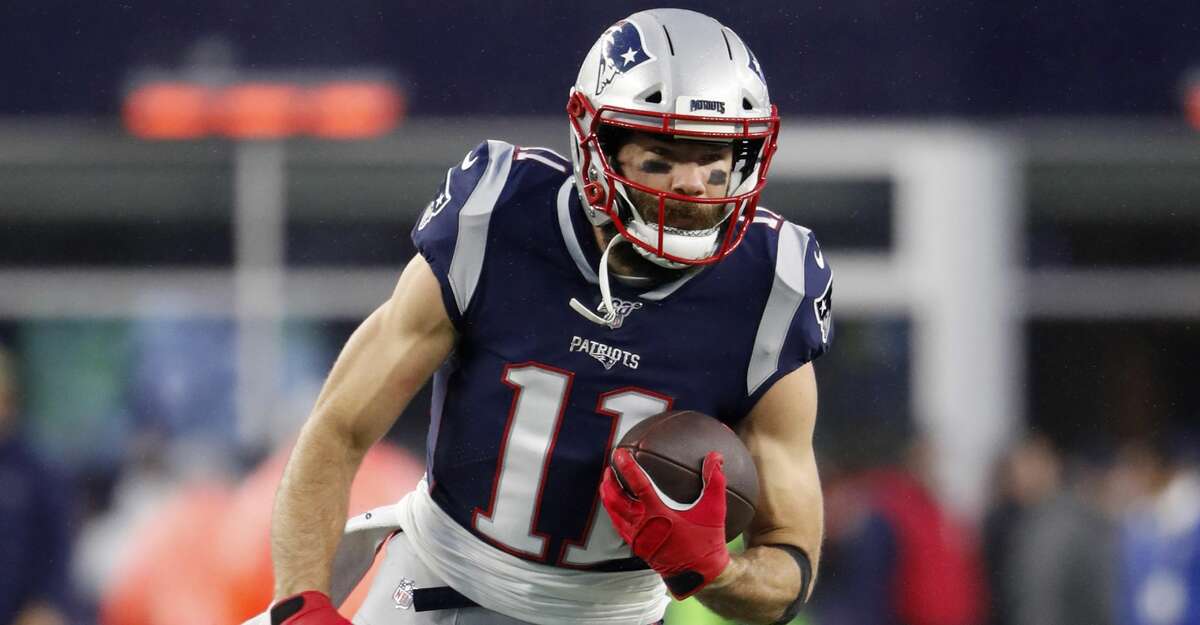 New England Patriots' Julian Edelman runs the ball before an NFL football game against the Dallas Cowboys at Gillette Stadium, Sunday, Nov. 24, 2019 in Foxborough, Mass. (Winslow Townson/AP Images for Panini)