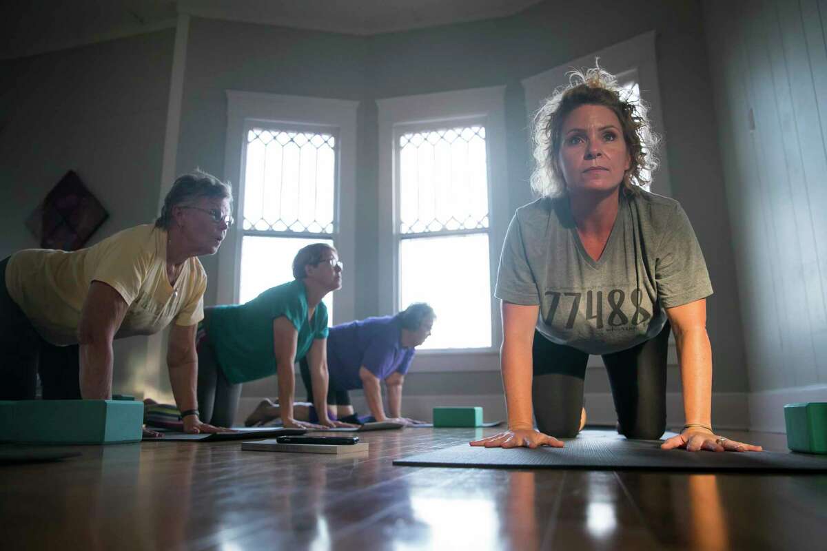 Stephanie Konvicka leads during a yoga class on Sept. 3, 2019, at Hesed House in Wharton.